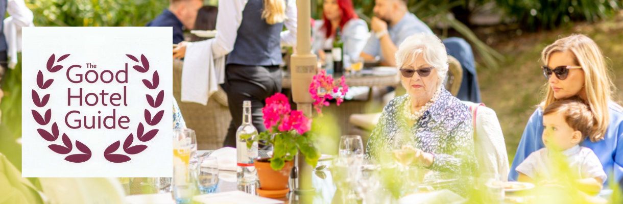 People dining outside in the garden at the Royal Hotel, Isle of Wight