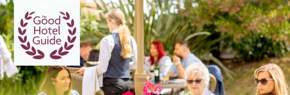 People enjoying dining within the gardens of The Royal Hotel on the Isle of Wight