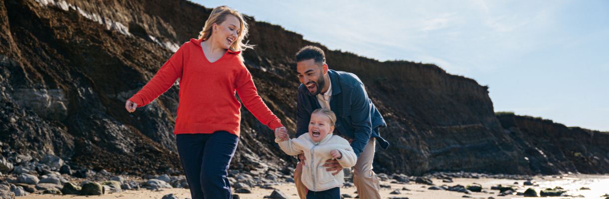 Family playing on the beach on the Isle of Wight