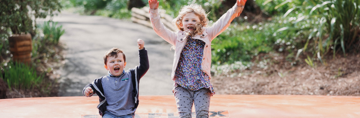 Girl and boy laughing at Robin Hill Adventure Park on the Isle of Wight