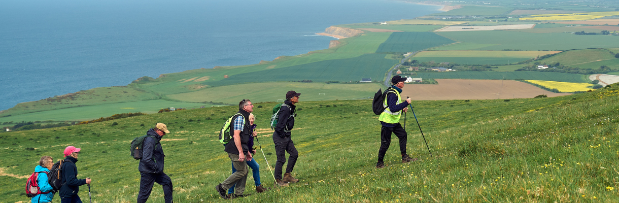 Group of walkers on a coastal walk on the Isle of Wight